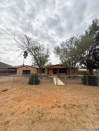 a backyard of a house with yard and garage