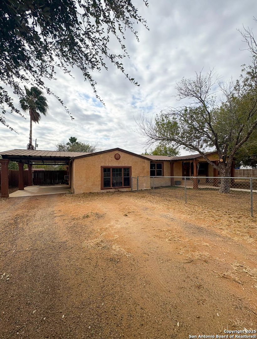 42 Mobile Road Cotulla, TX 78014 - Photo 3 of 21 a front view of a house with a yard