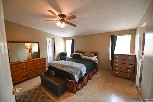 a bedroom with a bed and a dresser