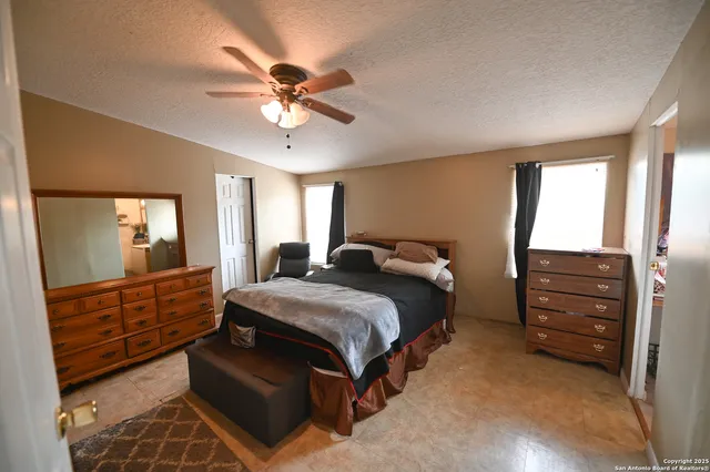 a bedroom with a bed and a dresser