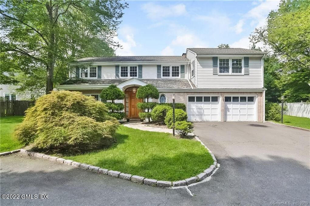 30 Split Timber Place Riverside, CT 06878 - Photo 1 of 45 a front view of a house with a yard
