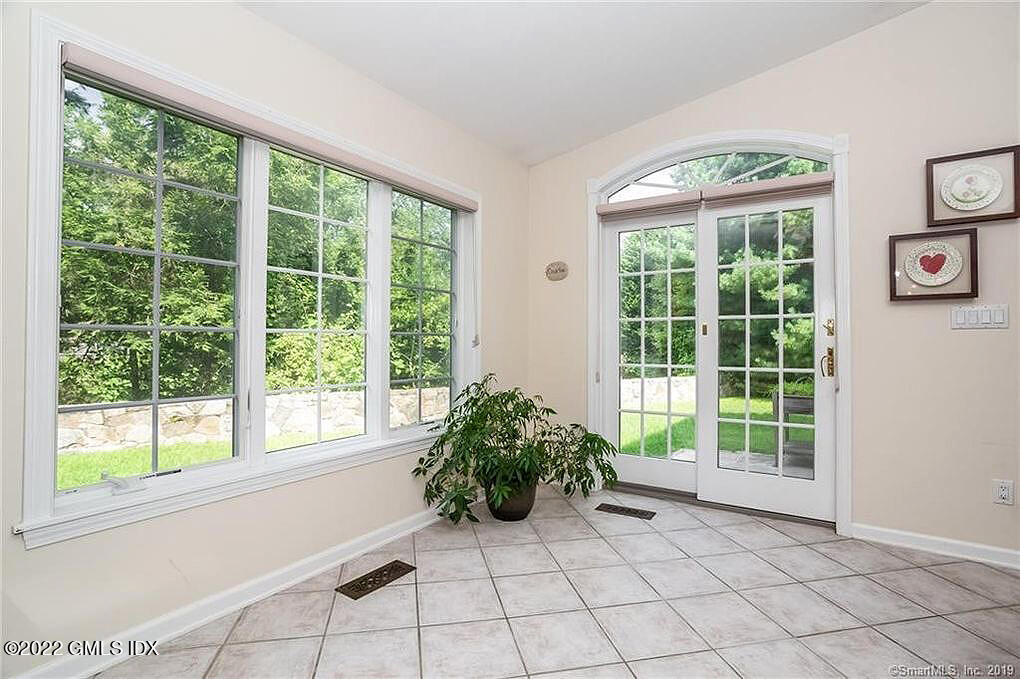 30 Split Timber Place Riverside, CT 06878 - Photo 15 of 45 a bed room with a bed and a large window