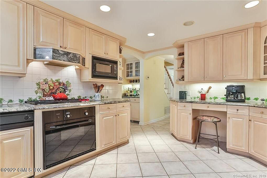 30 Split Timber Place Riverside, CT 06878 - Photo 19 of 45 a kitchen with granite countertop cabinets and steel stainless steel appliances