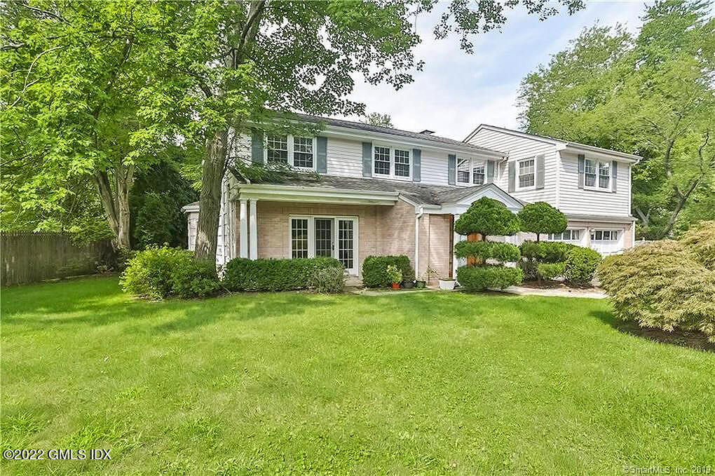 30 Split Timber Place Riverside, CT 06878 - Photo 2 of 45 a front view of a house with a yard