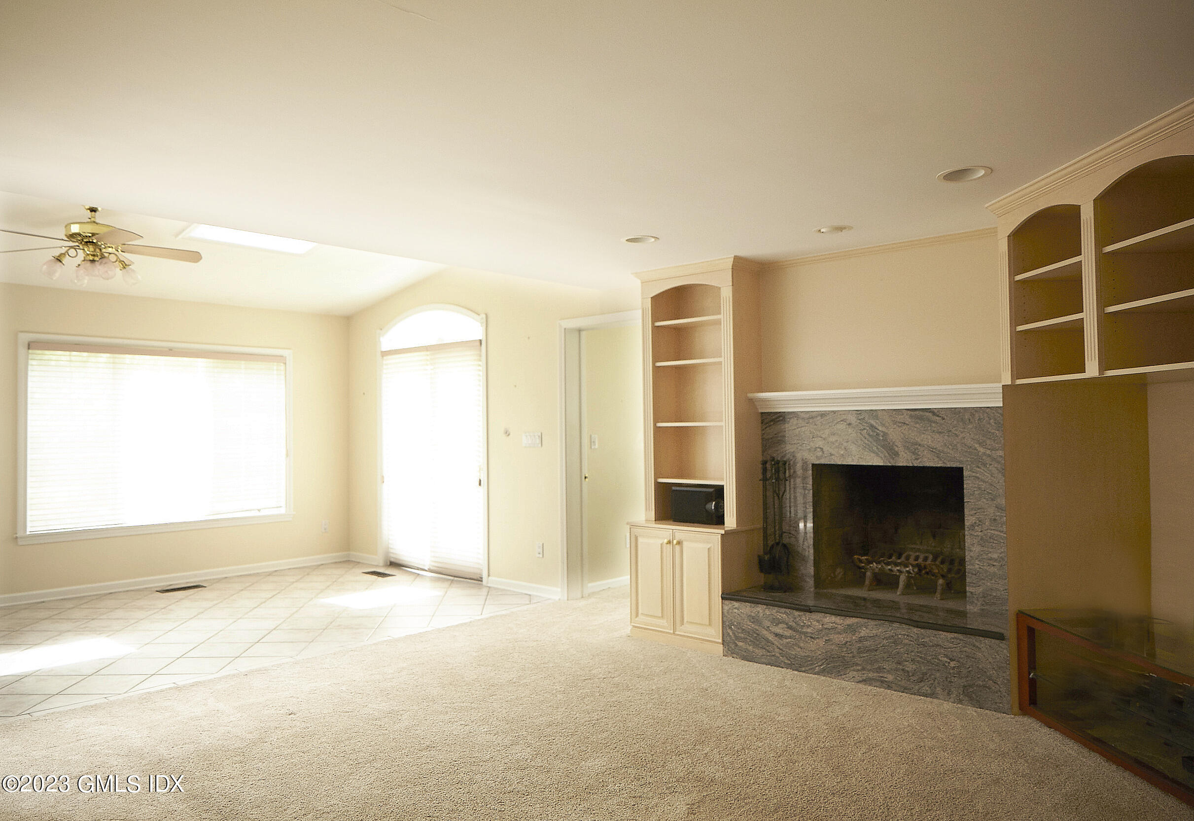30 Split Timber Place Riverside, CT 06878 - Photo 24 of 45 a view of livingroom with fireplace and window