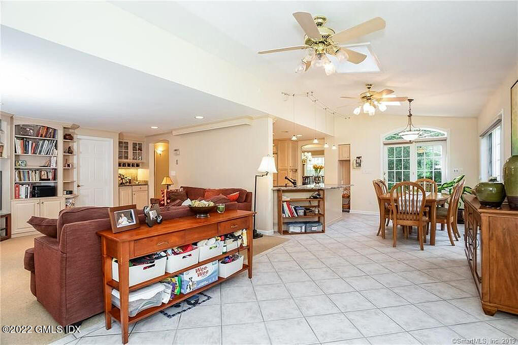 30 Split Timber Place Riverside, CT 06878 - Photo 26 of 45 a living room with furniture a fireplace and a chandelier