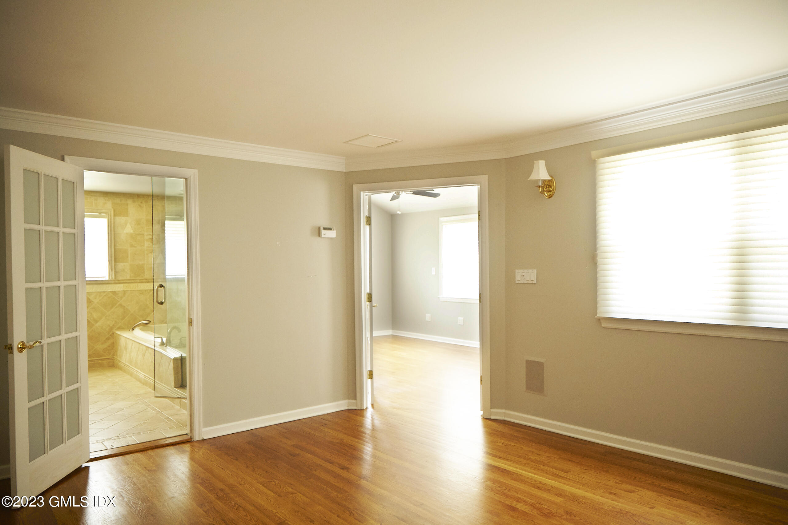 30 Split Timber Place Riverside, CT 06878 - Photo 34 of 45 an empty room with wooden floor and a window
