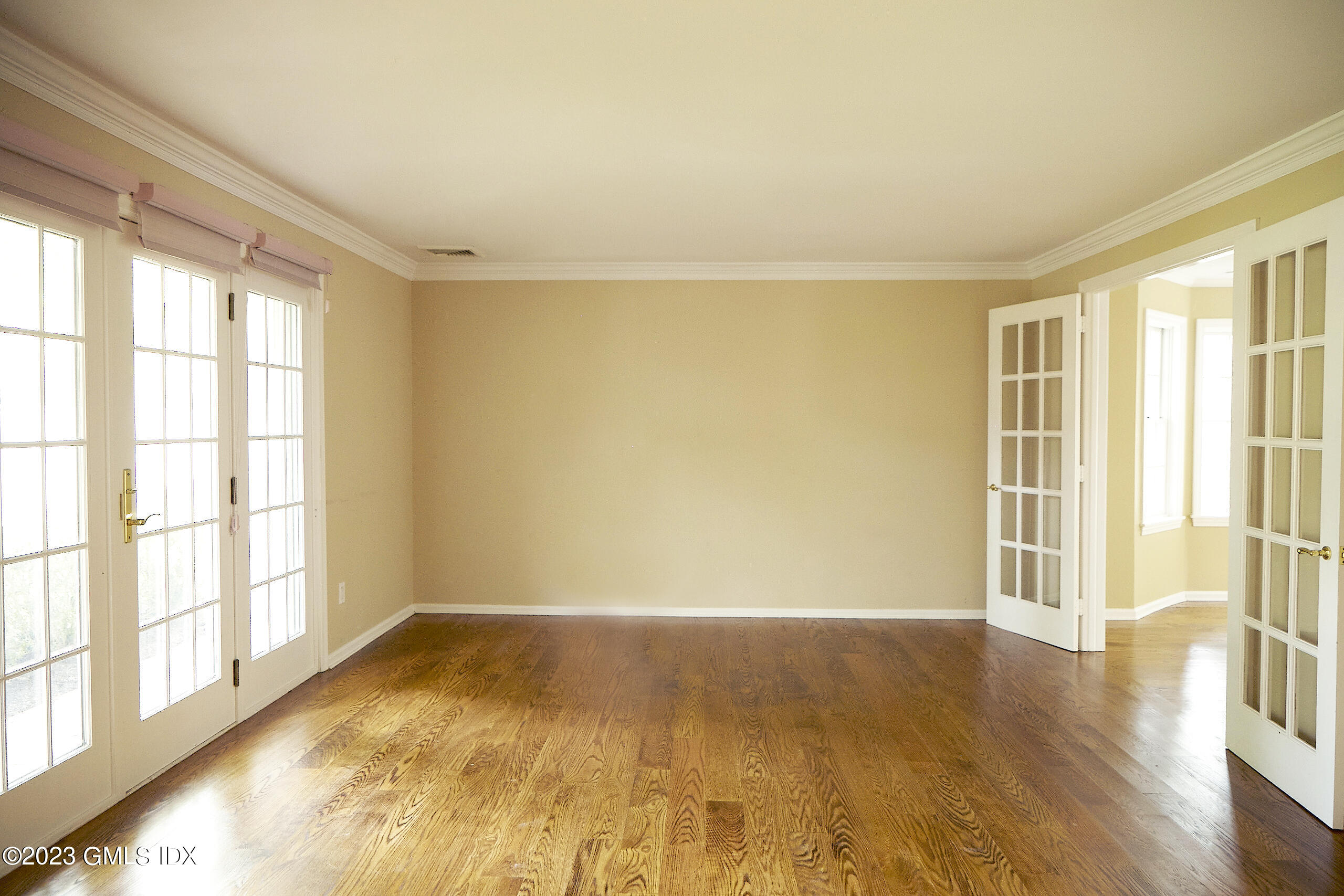 30 Split Timber Place Riverside, CT 06878 - Photo 9 of 45 a view of an empty room with a window and wooden floor