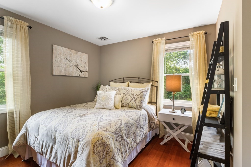 47 Victor Street Acushnet, MA 02743 - Photo 16 of 31 a bedroom with a bed and wooden floor