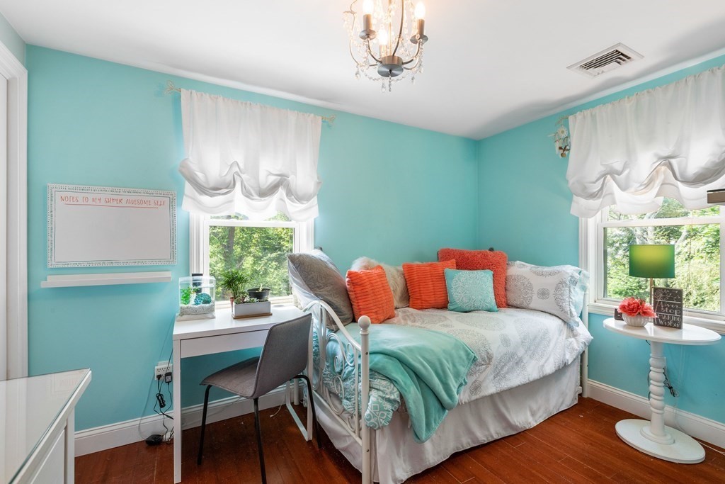 47 Victor Street Acushnet, MA 02743 - Photo 18 of 31 a living room with a bed mirror and a table