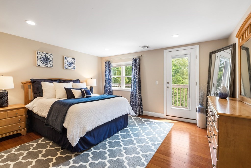 47 Victor Street Acushnet, MA 02743 - Photo 19 of 31 a spacious bedroom with a large bed and a large window