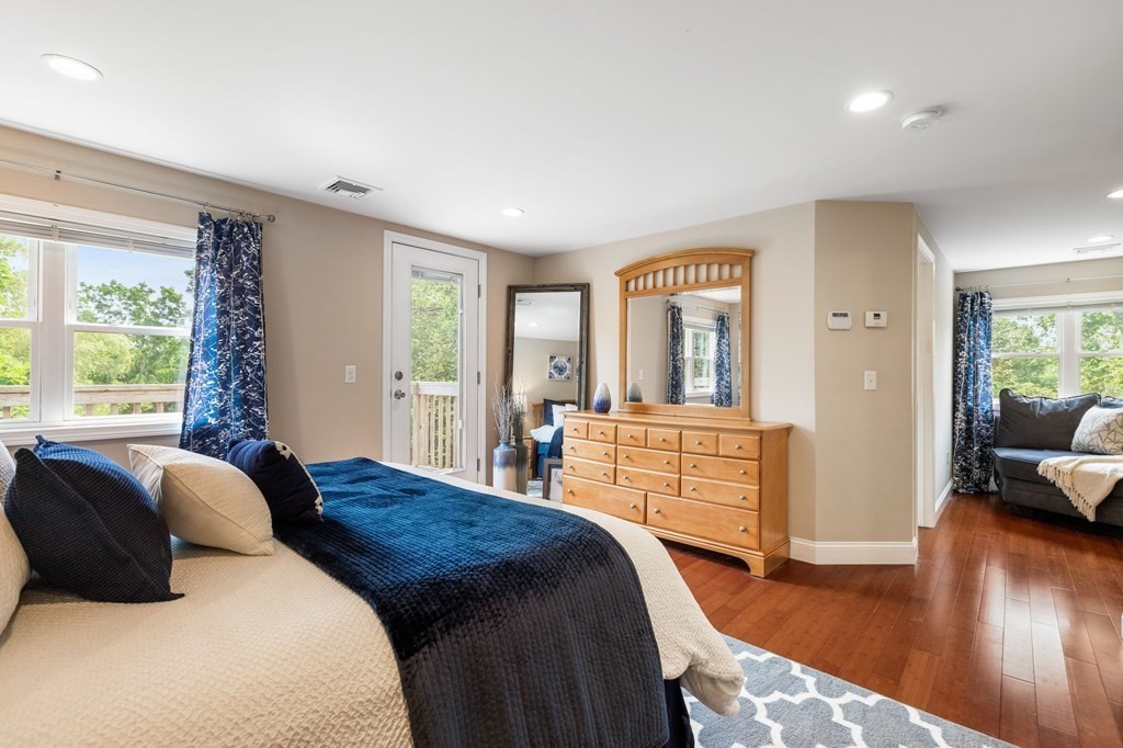 47 Victor Street Acushnet, MA 02743 - Photo 21 of 31 a bedroom with a bed and wooden floor