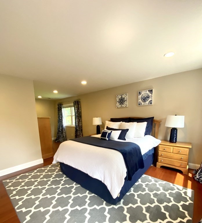 47 Victor Street Acushnet, MA 02743 - Photo 22 of 31 a bedroom with double bed and a lamp