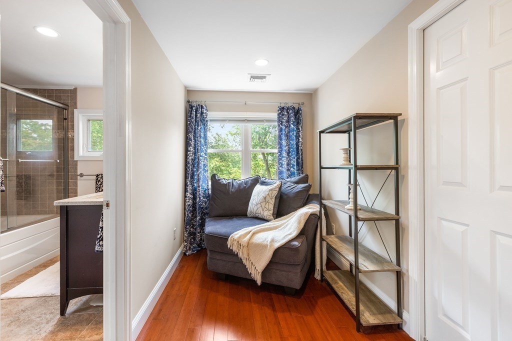 47 Victor Street Acushnet, MA 02743 - Photo 23 of 31 a living room with furniture floor to ceiling window and wooden floor