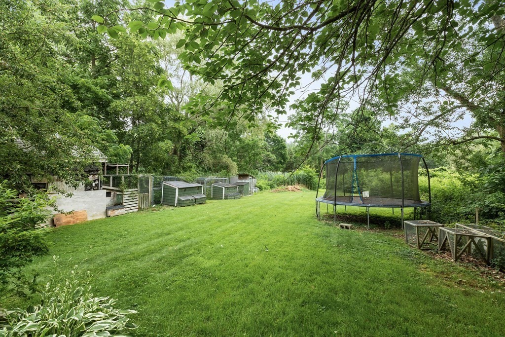 47 Victor Street Acushnet, MA 02743 - Photo 5 of 31 a view of a chair and table in the garden