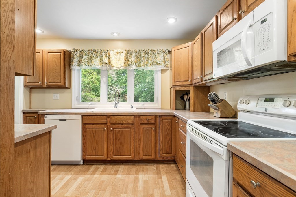 47 Victor Street Acushnet, MA 02743 - Photo 9 of 31 a kitchen with stainless steel appliances granite countertop a sink stove and cabinets
