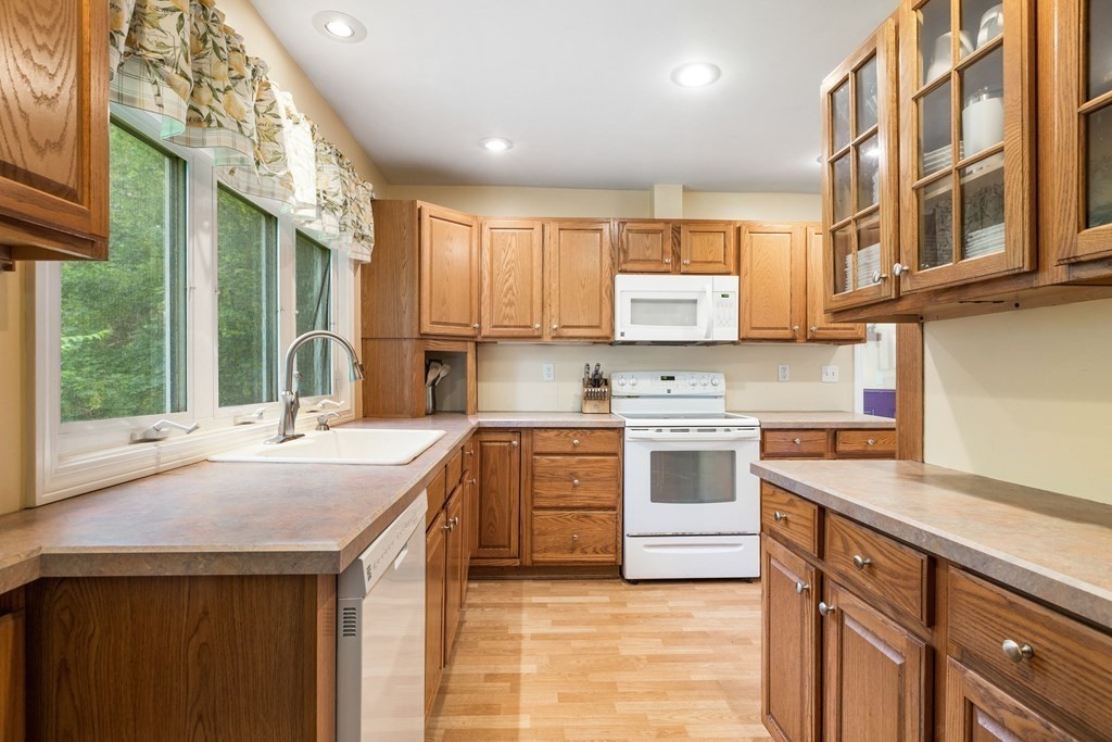 47 Victor Street Acushnet, MA 02743 - Photo 10 of 31 a kitchen with stainless steel appliances granite countertop a stove a sink and a microwave