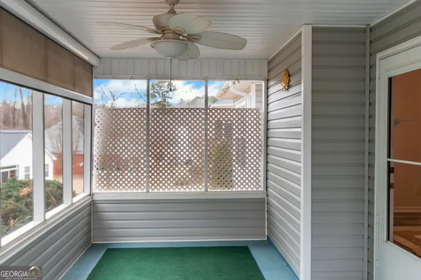 a view of room with window and ceiling fan