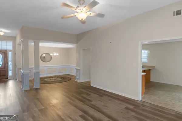 a view of a livingroom with wooden floor