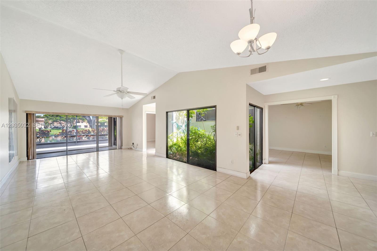 5223 Gate Lake Road, Unit 5223 Tamarac, FL 33319 - Photo 16 of 37 a view of an empty room with a window