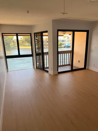 an empty room with windows and view