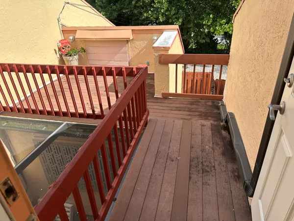 a view of outdoor space with deck and wooden floor
