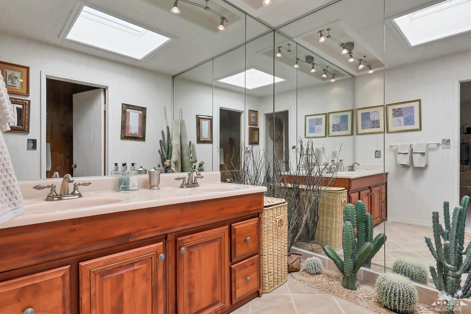 6 Palomas Drive Rancho Mirage, CA 92270 - Photo 14 of 20 a spacious bathroom with a sink double vanity granite and a mirror
