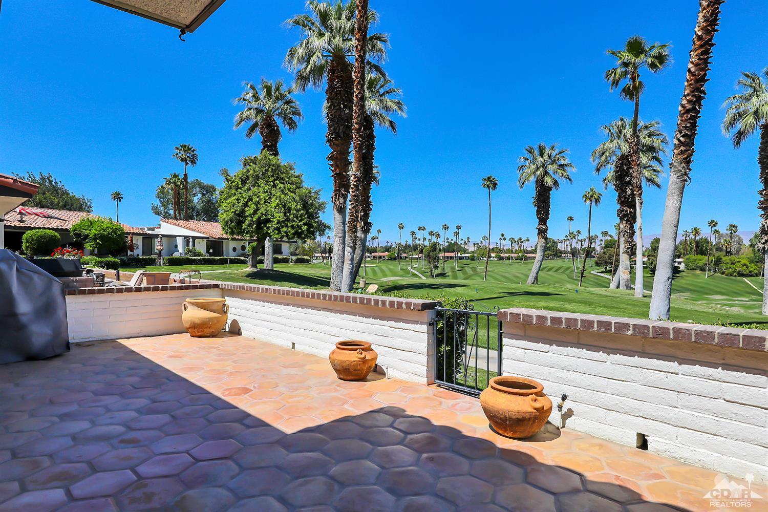 6 Palomas Drive Rancho Mirage, CA 92270 - Photo 15 of 20 a view of a swimming pool with a patio and a yard