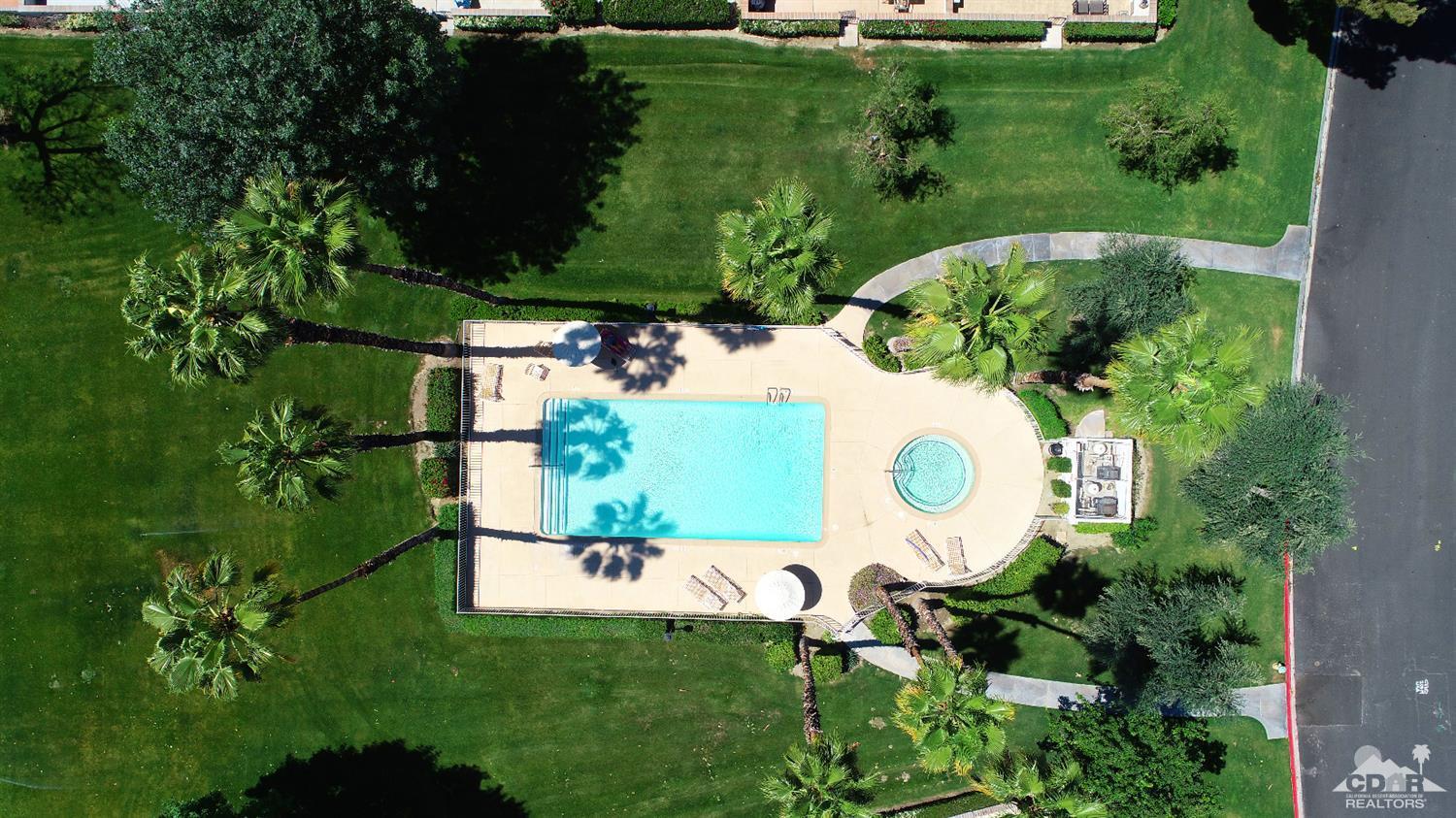 6 Palomas Drive Rancho Mirage, CA 92270 - Photo 18 of 20 an aerial view of a house with a yard and lake view