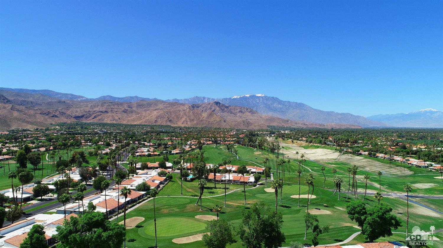 6 Palomas Drive Rancho Mirage, CA 92270 - Photo 19 of 20 a view of a lush green hillside and houses