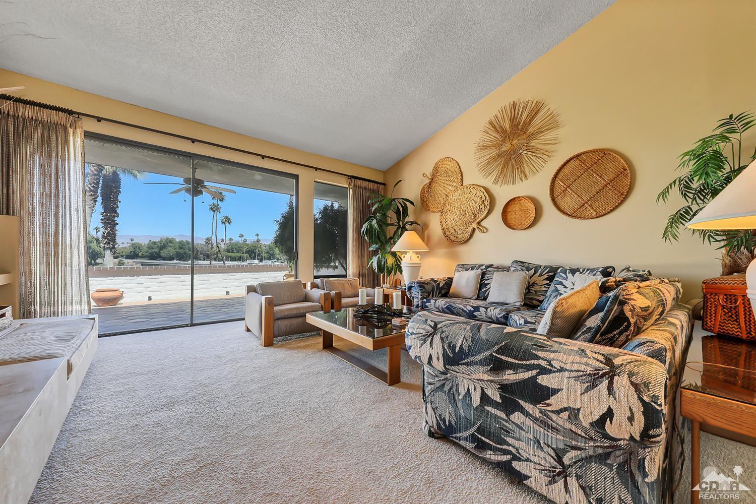 6 Palomas Drive Rancho Mirage, CA 92270 - Photo 5 of 20 a very nice looking room with a large window and a table
