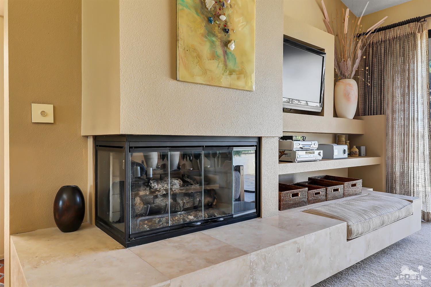 6 Palomas Drive Rancho Mirage, CA 92270 - Photo 6 of 20 a living room with stainless steel appliances furniture a rug and a window