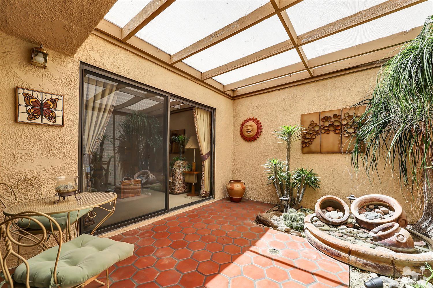 6 Palomas Drive Rancho Mirage, CA 92270 - Photo 7 of 20 a bedroom with a bed and a mirror