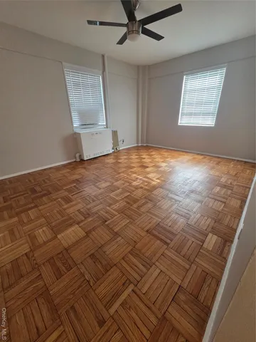 a bathroom with a bathtub shower sink vanity and toilet