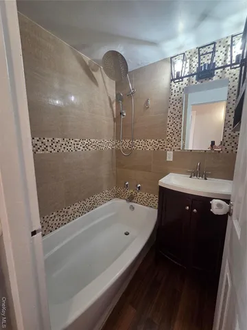 a bathroom with a toilet a sink and a mirror