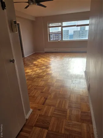 a view of a livingroom with wooden floor