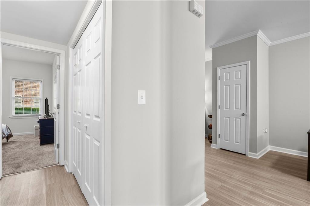 3675 Peachtree Road Northeast, Unit 45 Atlanta, GA 30319 - Photo 25 of 42 a view of a hallway with wooden floor and closet area