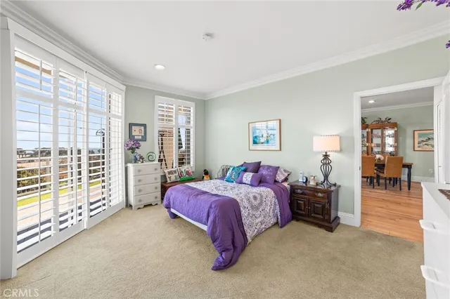 a spacious bedroom with a bed and a large window