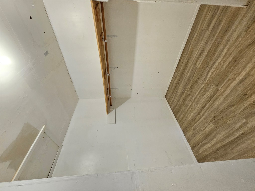 6000 Emerald Forest Drive, Unit A Austin, TX 78745 - Photo 16 of 19 a view of a room with wooden floor