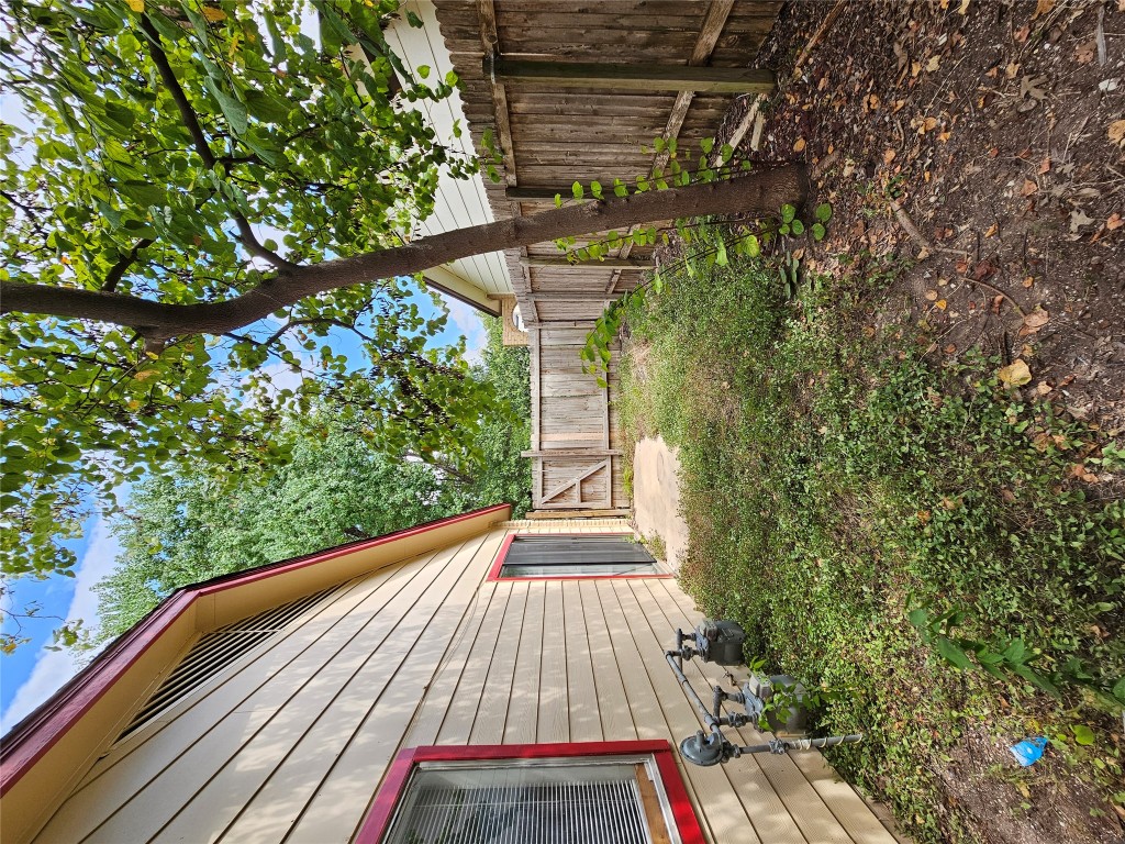6000 Emerald Forest Drive, Unit A Austin, TX 78745 - Photo 19 of 19 a backyard of a house with lots of green space