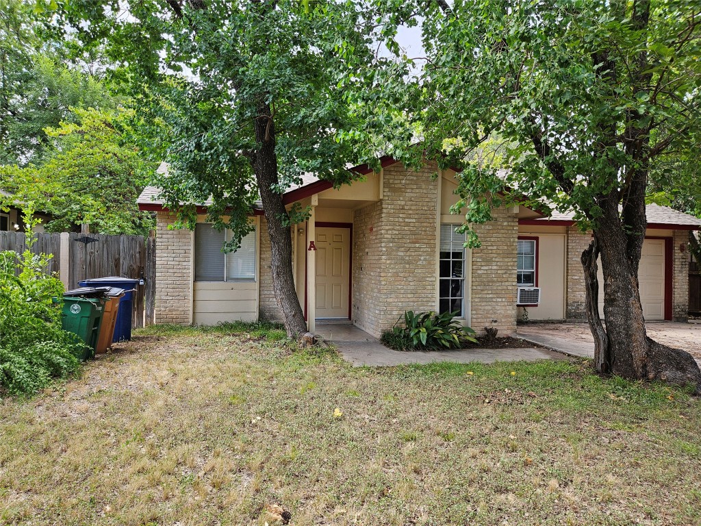 6000 Emerald Forest Drive, Unit A Austin, TX 78745 - Photo 2 of 19 a view of a house with a yard