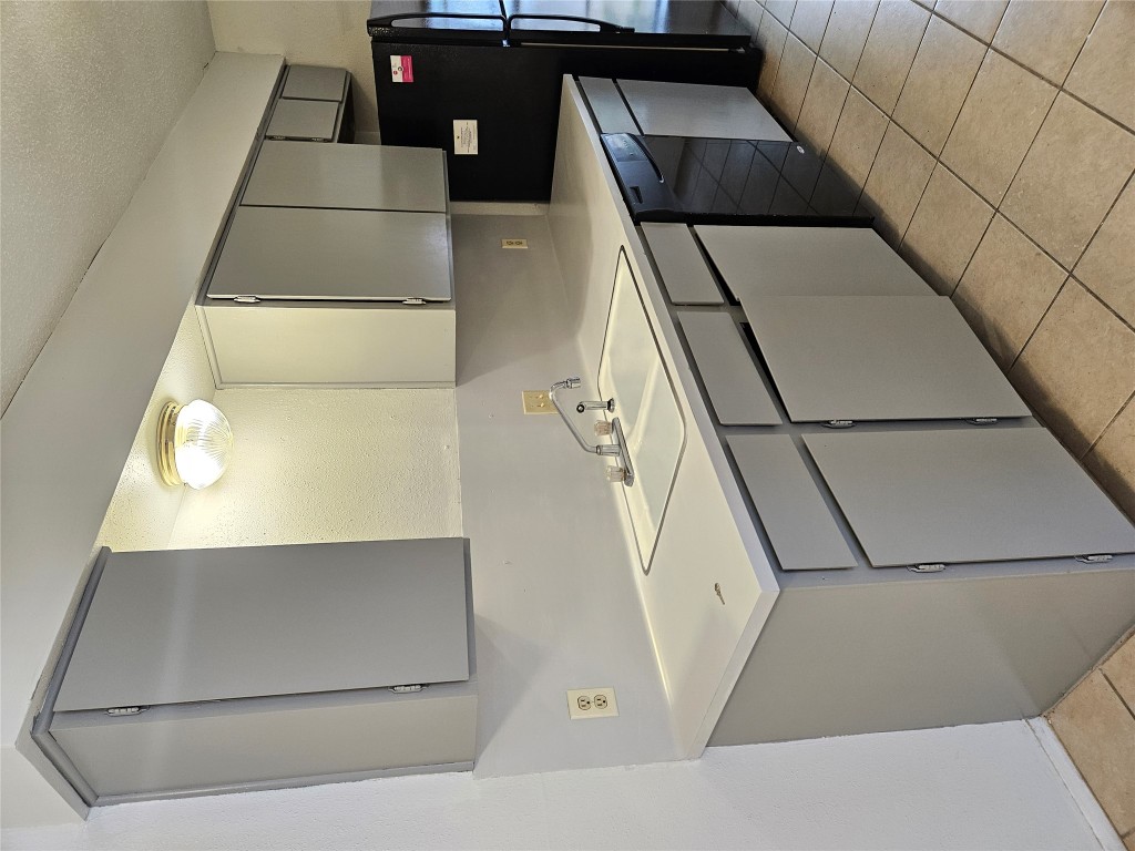 6000 Emerald Forest Drive, Unit A Austin, TX 78745 - Photo 6 of 19 a utility room with cabinets washer and dryer