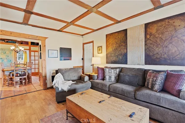 a living room filled with furniture and a table