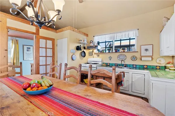 a view of a kitchen with furniture and a kitchen