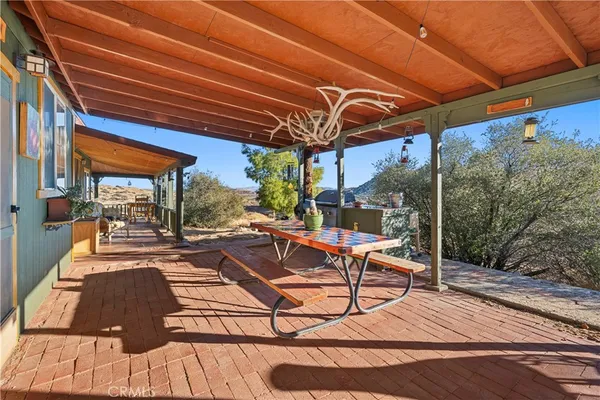 a view of a balcony with furniture
