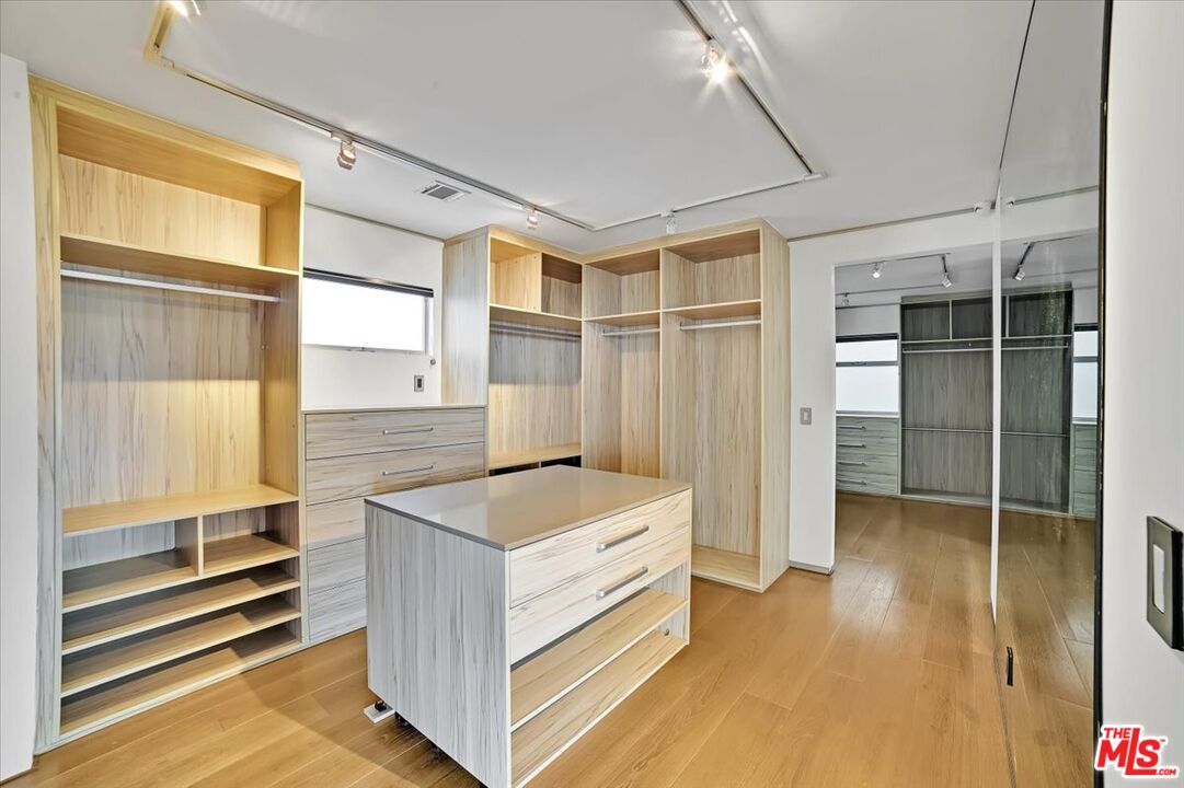 7044 Los Tilos Road Los Angeles, CA 90068 - Photo 14 of 58 a kitchen that has a sink and a wooden floor
