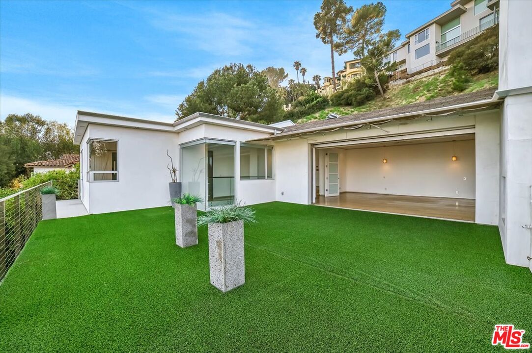 7044 Los Tilos Road Los Angeles, CA 90068 - Photo 17 of 58 a view of a house with backyard and garden