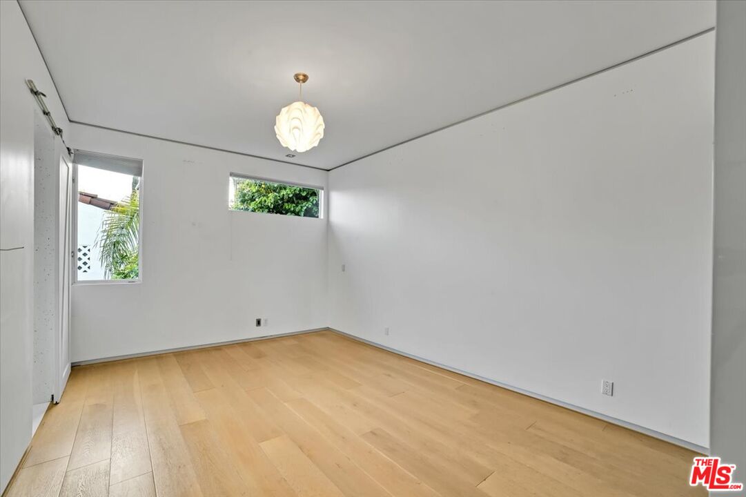 7044 Los Tilos Road Los Angeles, CA 90068 - Photo 22 of 58 an empty room with windows
