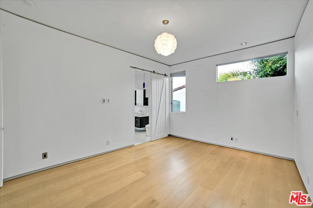 7044 Los Tilos Road Los Angeles, CA 90068 - Photo 23 of 58 a view of an empty room with a window