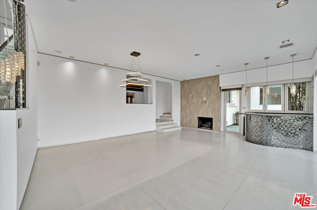 7044 Los Tilos Road Los Angeles, CA 90068 - Photo 30 of 58 a view of an empty room with a fireplace